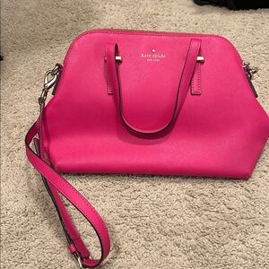 Kate spade pink handbag. Some slight wear inside but otherwise great condition!